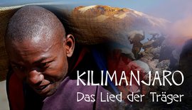Träger mit Kilimanjaro Hintergrund